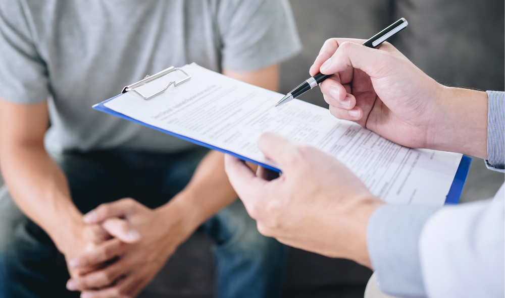 person speaking with a doctor about genital reconstruction surgery