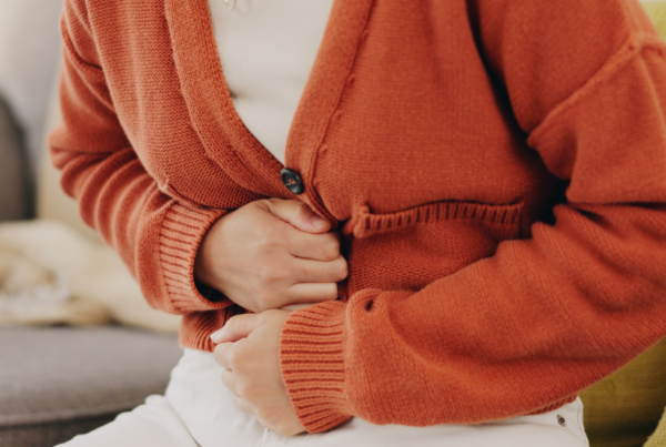 Person experiencing abdominal pain because of obstructive defecation