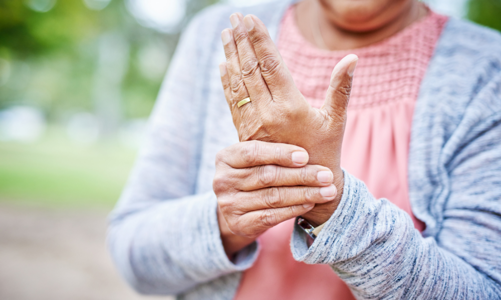 Person experiencing pain from osteoarthritis in their hand