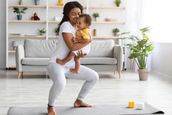 Woman exercising with her baby