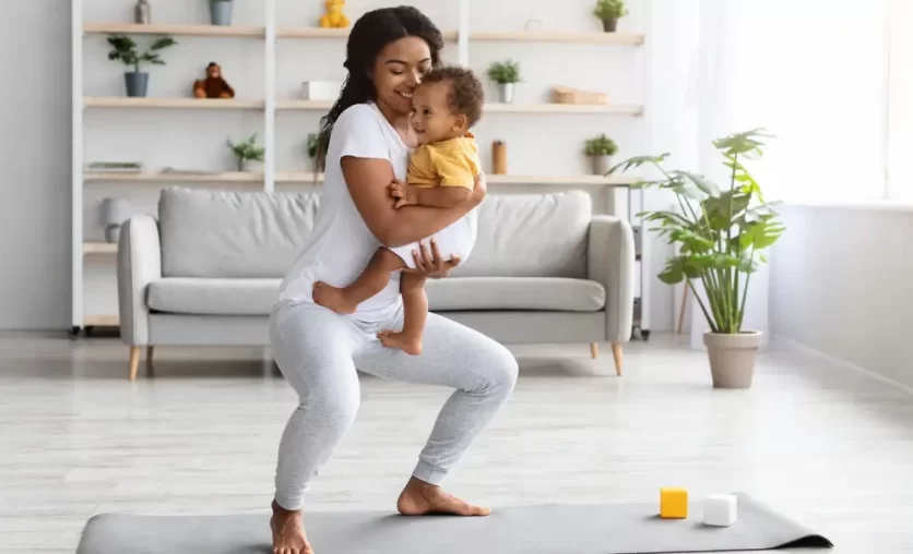 Woman exercising with her baby