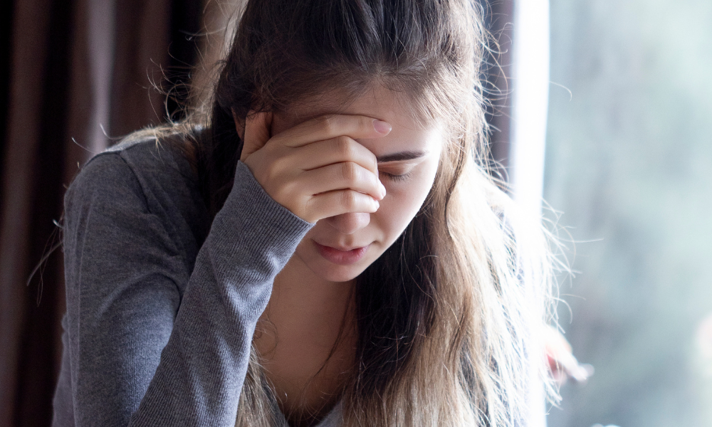 Person experiencing dizziness from vertigo