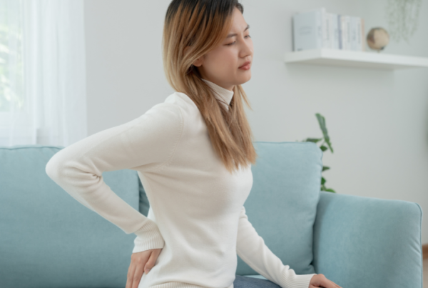 Person with myofasical pain syndrome causing pain in their back