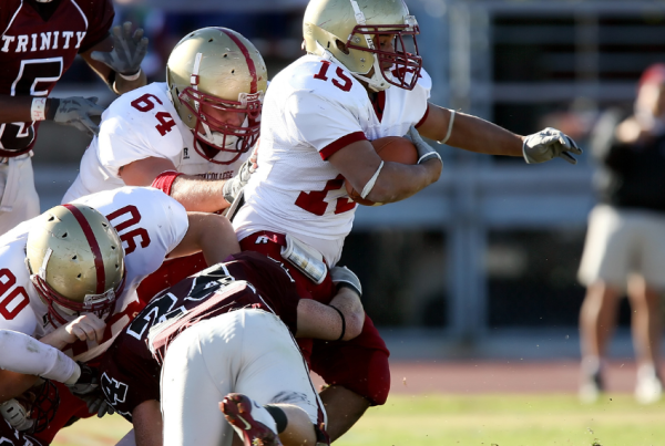 Football players colliding during a game