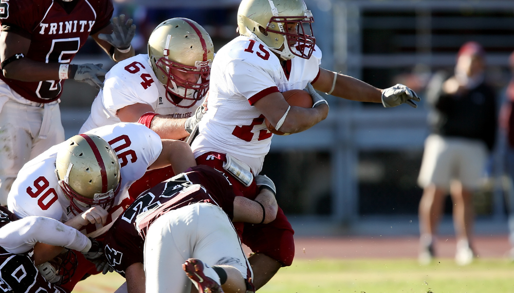 Football players colliding during a game