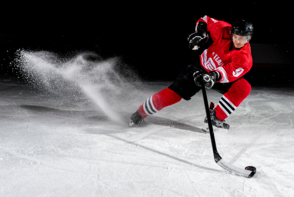 Dramatic image of a person playing hockey
