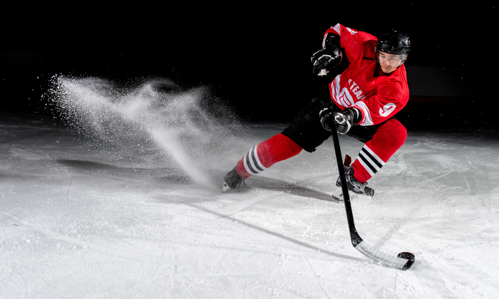 Dramatic image of a person playing hockey