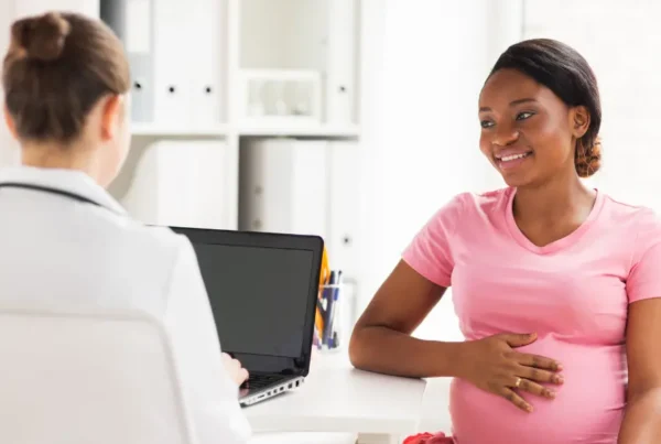 Pregnant person speaking to a doctor about rib flare